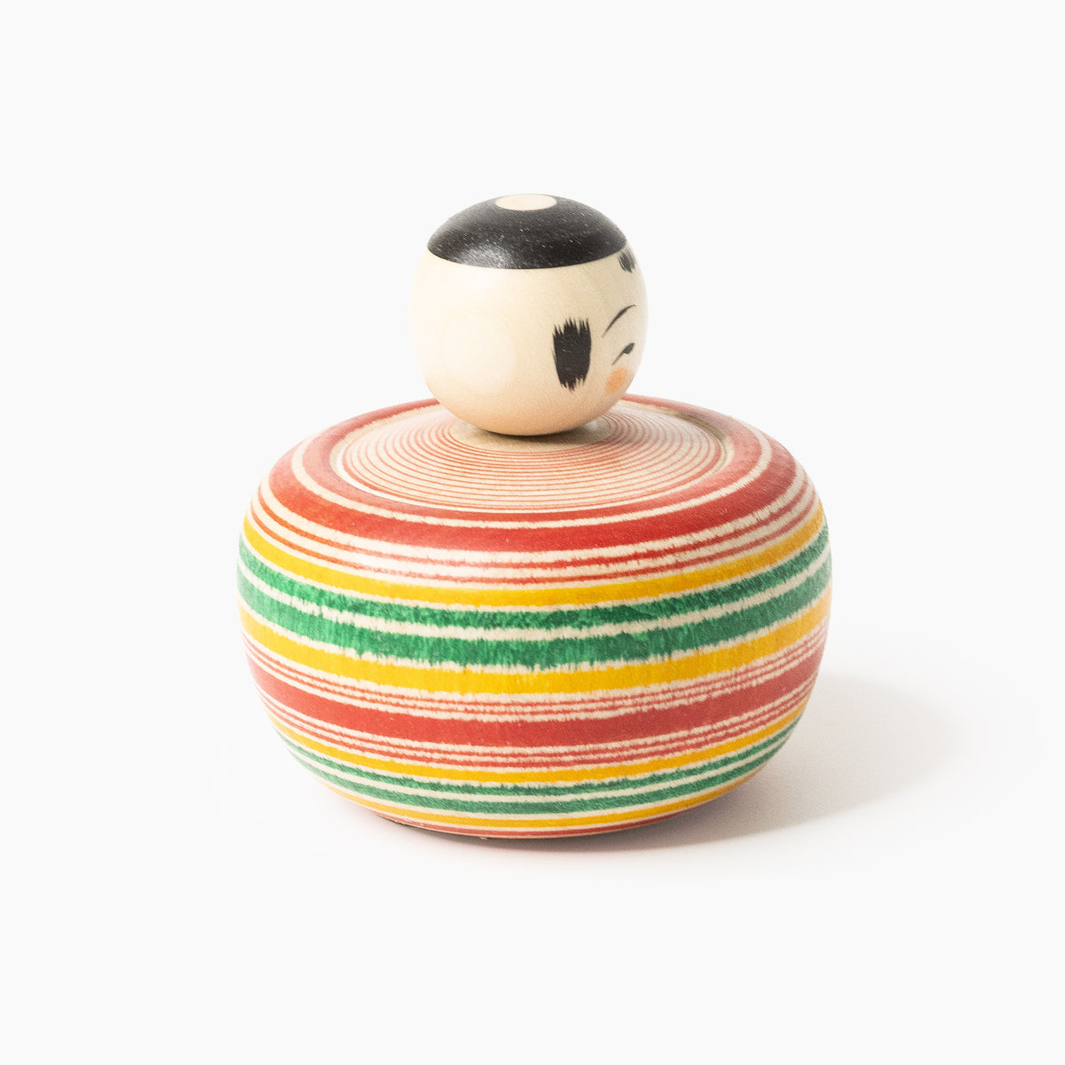 Makoto-style Ejiko kokeshi in red and green in three-quarter rear view