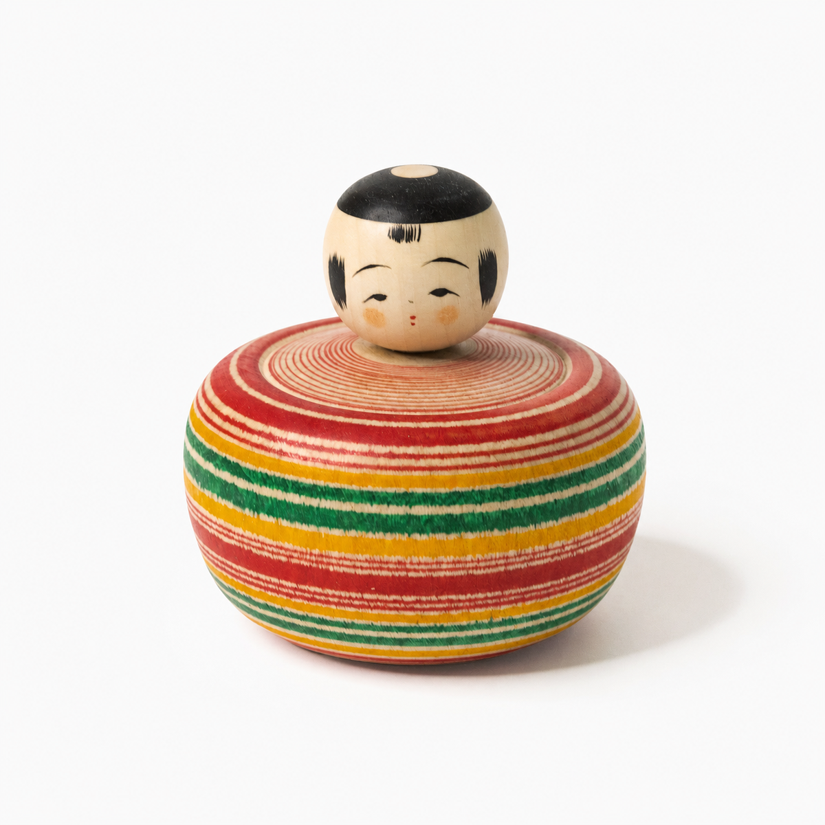 Red and green Bōzu Ejiko kokeshi by Yusuke Sato.