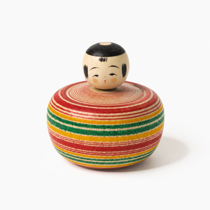 Red and green Bōzu Ejiko kokeshi by Yusuke Sato.