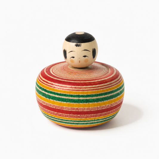 Red and green Bōzu Ejiko kokeshi by Yusuke Sato.