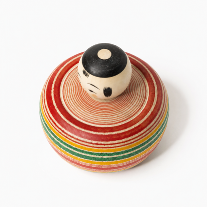 Red and green Bōzu Ejiko kokeshi by Yusuke Sato.