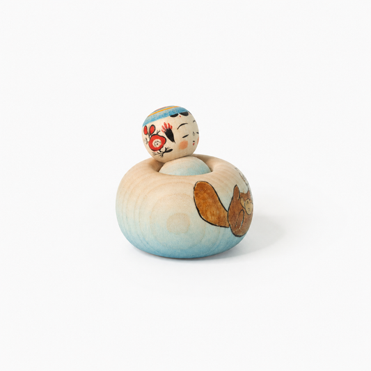 Hand-painted sea otter Ejiko kokeshi by Yusuke Sato.