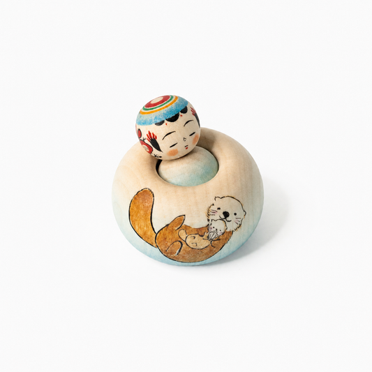 Hand-painted sea otter Ejiko kokeshi by Yusuke Sato.