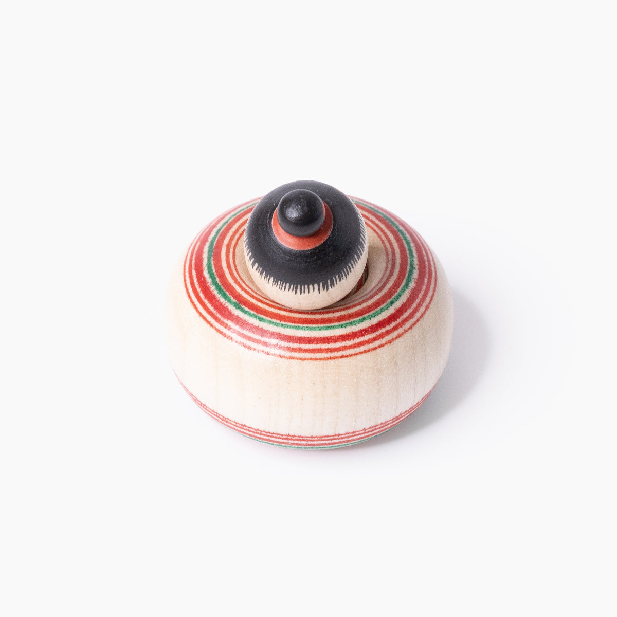 Mini-Ejiko-Kokeshi in Draufsicht mit schwarzem Haarknoten