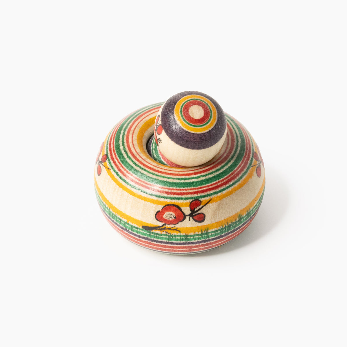 Pflaumenblüten-Ejiko-Kokeshi in Draufsicht mit Ringmuster am Kopf