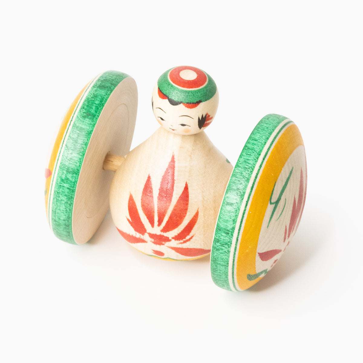 Wooden Fuku Kuruma figure with red chrysanthemum in three-quarter front view